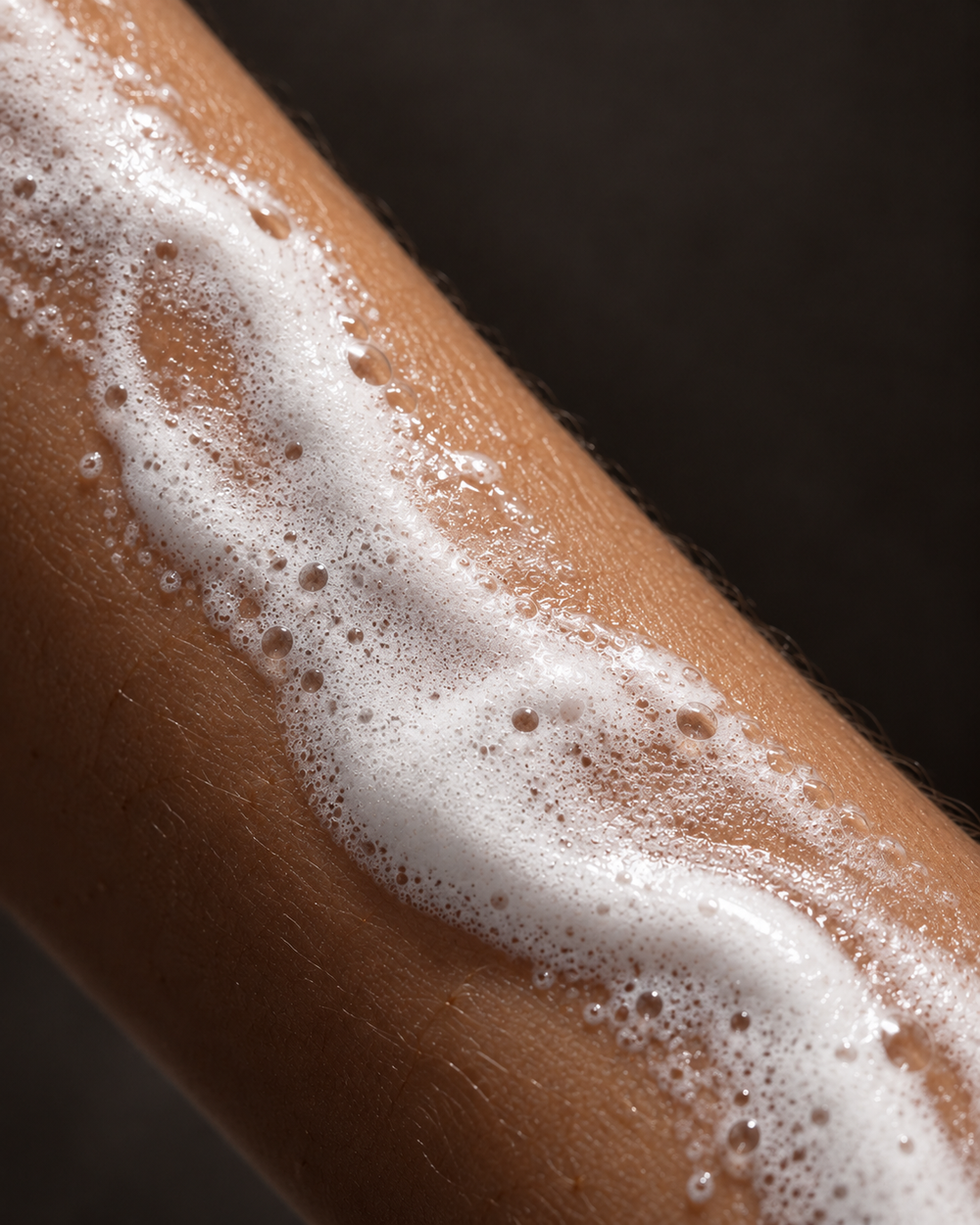 White lather on a wet forearm.